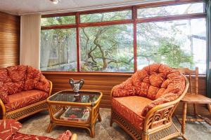 a living room with two chairs and a table at Host & Stay - Windles in Wotton-under-Edge +18 photos