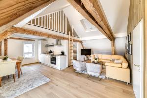 a living room with a couch and a table at Ferienwohnung Alpen Zentral in Bludenz