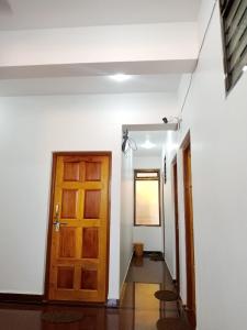 a room with a door and a hallway with a hallway at Prakash Holiday Inn in Arambol +193 photos