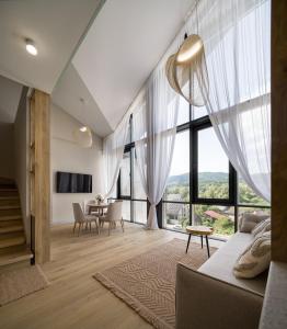 a living room with a couch and a table at RIKKA KHUST thermal resort in Khust