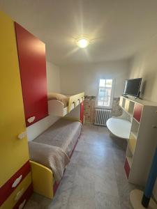 a room with two bunk beds and a television at Villa Lelli 2 in Rome