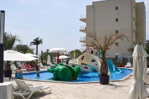 a pool with a water slide in a resort at Apartament Horizon by Alz in Mamaia Sat/Năvodari +29 photos
