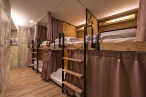 Postel nebo postele na pokoji v ubytování Beimen WOW Poshtel