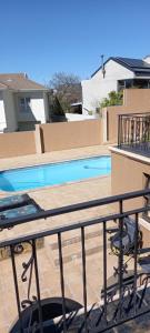 a view of a swimming pool from a balcony at 22 on Shiraz 2 in Bellville