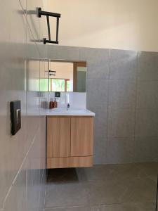 a bathroom with a sink and a mirror at Permata Villas Lombok in Kuta Lombok