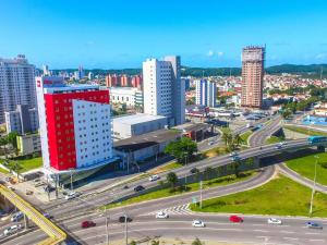 a city with traffic on a highway and buildings at ibis Natal in Natal