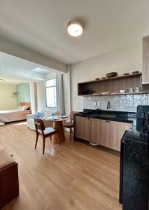 a large room with a kitchen and a living room at Iara & Muira Apartments in Belém