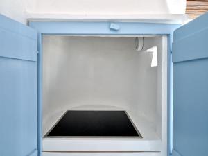 a blue drawer with a tablet inside of it at Brunella Paros in Naousa