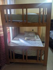 a set of bunk beds in a room at Mashingo Homestay in Dar es Salaam +12 photos
