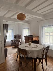a dining room with a table and chairs at Бабусина хатка in Leplyavo