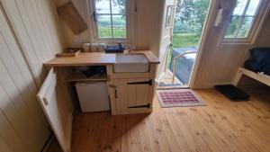 a small kitchen in a tiny house with a sink at Robin in Priston