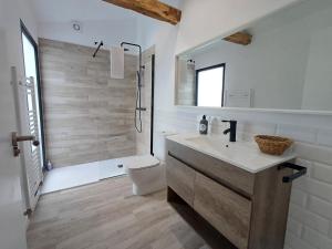 a white bathroom with a sink and a shower at M1 Preciosa casa reformada con gran patio exterior in Ourense +20 photos