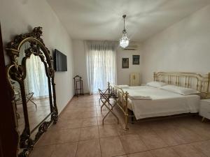 a bedroom with a bed and a large mirror at Bari Double Sea View in Bari +20 photos
