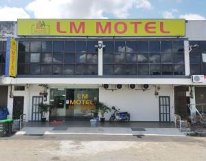 a sign on the front of a motel at LM Motel in Kulim