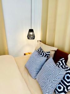 two pillows sitting on top of a couch at THARA PHLU BUNGALOWS Koh Chang in Ko Chang +118 photos
