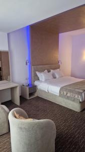 Ένα ή περισσότερα κρεβάτια σε δωμάτιο στο City Hotel