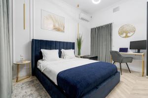 a bedroom with a bed and a desk and a chair at Villa for rent with Garden - High Ceilings Bucharest Free Park in Bucharest +59 photos