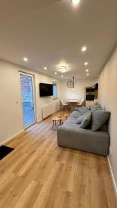 a living room with a couch and a table at Ferienwohnung Anja in Münnerstadt