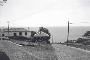 a black and white photo of a house on a road at SeaSalt Whisper - Guest House in Calheta
