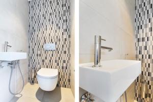 Un baño con lavabo e inodoro en BizStay Toren van Oud, en La Haya 54 fotos más