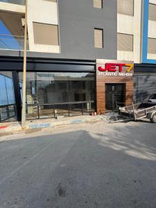 a building under construction with a sign on it at LITTLE Mehdia in Mehdiya-Plage +3 photos