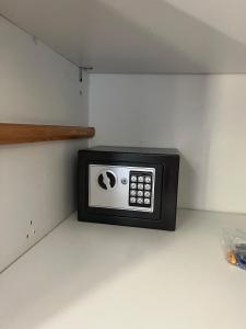 a microwave sitting on a shelf in a kitchen at El Gouna Nubian Lagoonfront Villa - 4BR, 9 Guests in Hurghada