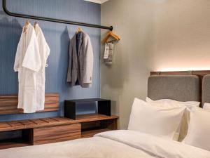 En eller flere senge i et værelse på Novotel Santiago Las Condes