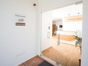 an office with a door leading to a room at Tavira Monte in Tavira