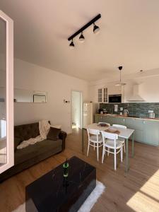 a living room with a couch and a table at Il Gelsomino in Crema