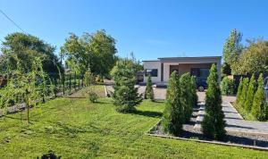 a garden in front of a house at Respiro Villas in Tîrgu Neamţ