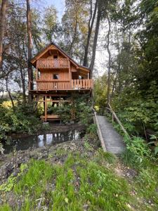 a tree house in the middle of a forest at Tree house - Ethno holistic village Apače in Apače