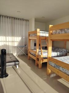 Katil atau katil-katil dalam bilik di Exclusiva casa de campo en Condominio La Hacienda - Ica