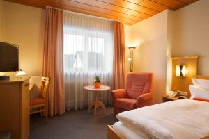 Postel nebo postele na pokoji v ubytování Kur- und Wellnesshotel Förch