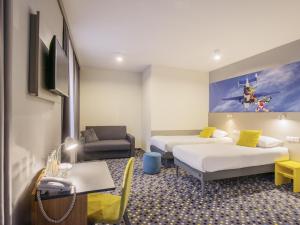 Un pat sau paturi într-o cameră la ibis Styles Warszawa West