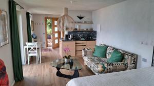 a living room with a couch and a table at Casa Lago Azzurro Atelier in Cannobio