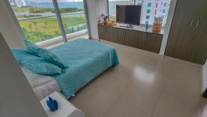 a bedroom with a bed and a large window at Apartamento moderno con vista al mar en Pozos Colorados in Santa Marta +28 photos