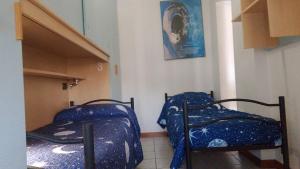 Ένα ή περισσότερα κρεβάτια σε δωμάτιο στο Erasmus Home