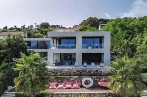 a house on a hill with palm trees at Beautiful palm tree villa in Marrakech