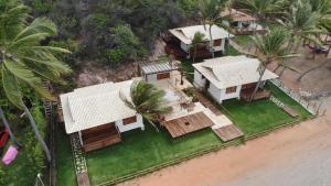 an aerial view of a house on the beach at Vila Picos Icapui in Icapuí