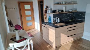 a kitchen with a counter and a table and a counter top at Casa Lago Azzurro Atelier in Cannobio