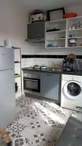 Η κουζίνα ή μικρή κουζίνα στο Grand Studio Porte de paris