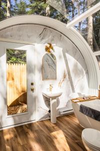 a bathroom with a sink and a tub and a toilet at Sunken Escapes #3 Kit's Retreat in New Minas