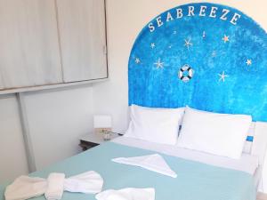 a bedroom with a bed with a soccer ball on it at Faros studios Kalymnos Lighthouse in Kalymnos