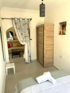 Ένα ή περισσότερα κρεβάτια σε δωμάτιο στο La Perle de Marchane