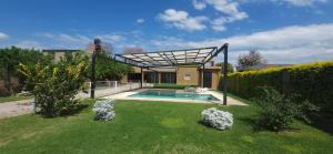 a swimming pool in the yard of a house at Finca Las Tres Hermanas en La Banda in La Banda