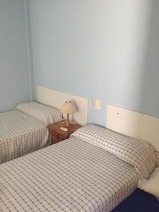 Postel nebo postele na pokoji v ubytování Hostal L'Escaleta