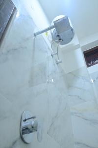 a white bathroom with a sink and a toilet at Shree Ramanam Palace in Ayodhya +19 photos