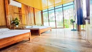 Ένα ή περισσότερα κρεβάτια σε δωμάτιο στο Homestay Suối Mây Garden