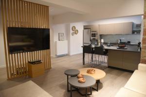 a large living room with a kitchen and a living room at The Cozy Flat 88m2 in Mytilini