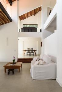 Ένα ή περισσότερα κρεβάτια σε δωμάτιο στο Refúgio com vista mar e verde